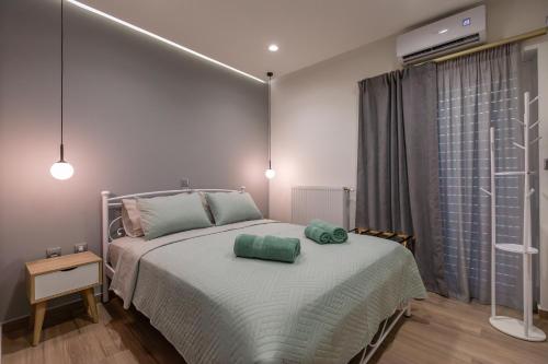 a bedroom with a bed with two pillows on it at My Nafpaktos Resort in Nafpaktos