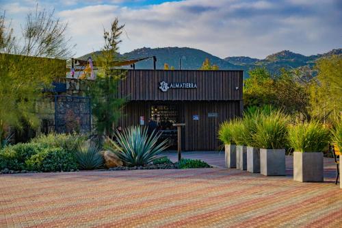 a building with plants in front of it at OJO AZUL RESORT in Valle de Guadalupe