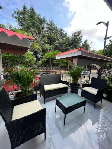 a group of chairs and tables on a patio at Novapark Ferroviaria in Guayaquil