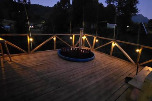 a circle of lights on a wooden deck at night at Cabaña Puelo 01 in Puelo