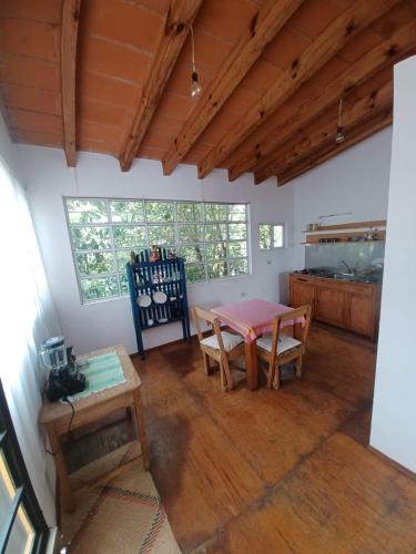 a room with a table and chairs and a window at Linda casa en Tepoztlan centro 2 in Tepoztlán