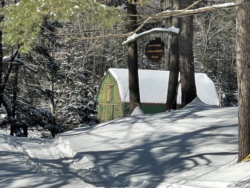 a tent in the woods with snow on the ground at Mountain Retreat on Private Lake-Alderbrook Lodge in Bolton