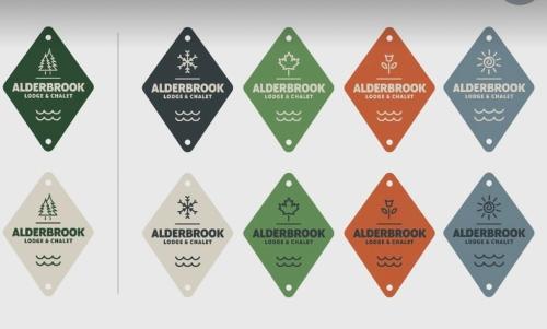 a group of eight differently colored aprils with theagencyagency desert service logo at Chalet on Private Alderbrook Lake in Bolton