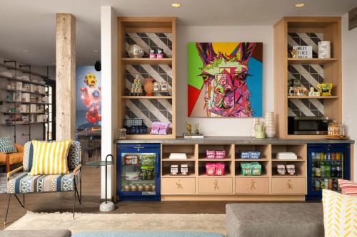 a shop with a colorful painting on the wall at Moxy Santa Barbara in Santa Barbara