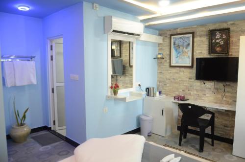 TV a/nebo společenská místnost v ubytování Isle Inn Guesthouse