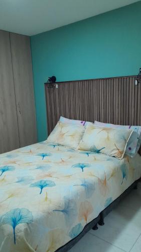 En eller flere senge i et værelse på Apartamento vacacional amoblado