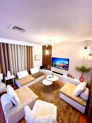 TV a/nebo společenská místnost v ubytování Mango Oasis 1