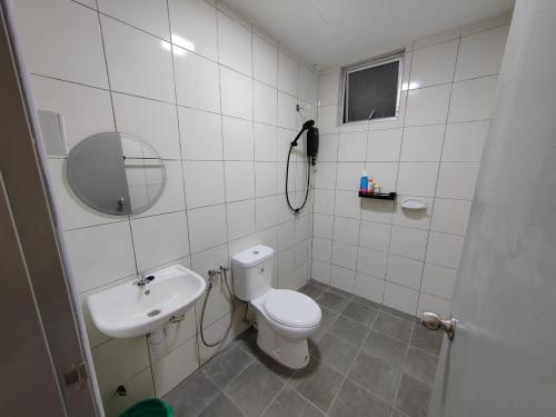 a bathroom with a toilet and a sink at Zanayra Homestay in Melaka
