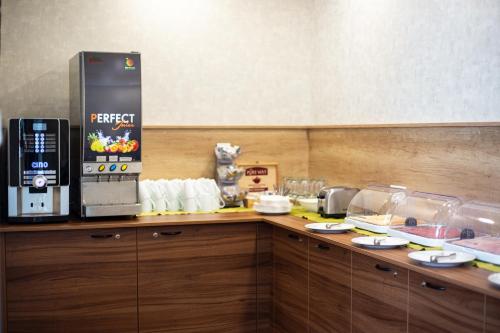 a kitchen with a counter with a coffee maker at Wellness Penzión Ferrata in Martin