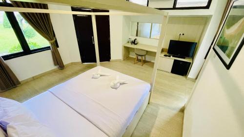 Μια τηλεόραση ή/και κέντρο ψυχαγωγίας στο Aman Gati Hotel Lakey