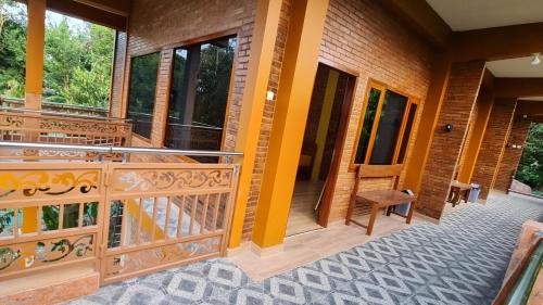 a balcony of a house with a wooden railing at Anugrah Borobudur in Borobudur