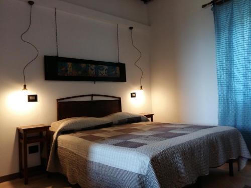 En eller flere senge i et værelse på La Tana Del Riccio