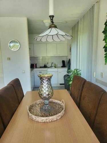 a vase sitting on top of a wooden table at Sleepspot Wedde in Wedde