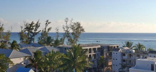 a view of the ocean from a building at Seaside Escape Apartment in Flic-en-Flac