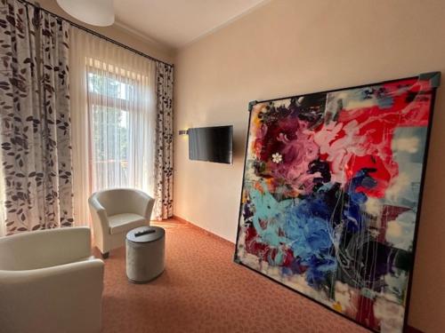 TV a/nebo společenská místnost v ubytování Das WALDFRIEDE Appartement
