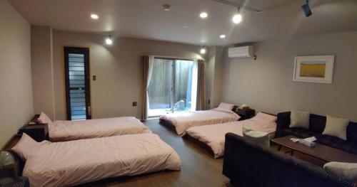 Postel nebo postele na pokoji v ubytování Guest House WA
