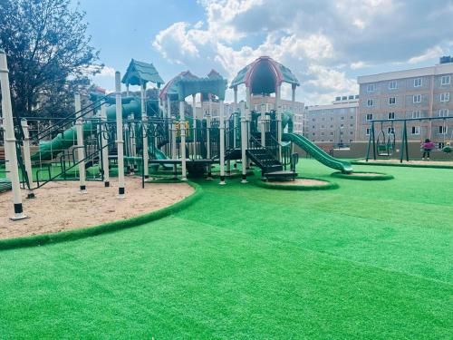 a playground with a slide in a park at Sweet Homes furnished apartments Nakuru in Nakuru