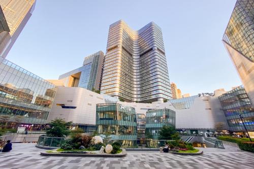 a large building with tall skyscrapers in a city at Guangzhou He She Art Apartment in Guangzhou
