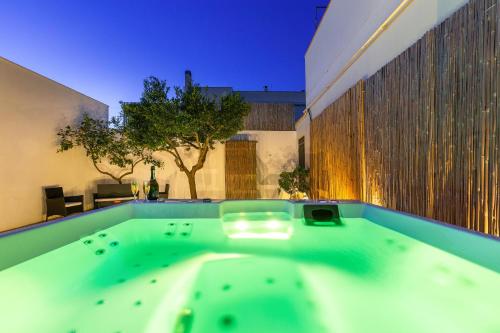 a hot tub in the backyard of a house at Salento Inside in Morciano di Leuca