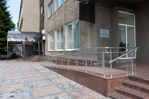 a building with a metal railing on the side of it at Kremin Hotel in Kremenchuk