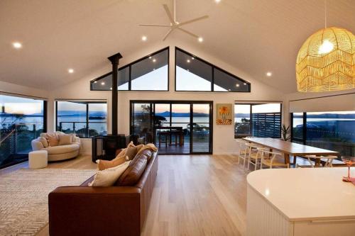 a large living room with a couch and a table at Bruny Island Sunset Retreat in Alonnah