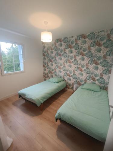 Photo de la galerie de l'établissement Villa 115 M2, 250 M plage, commerce et gare, à Châtelaillon-Plage