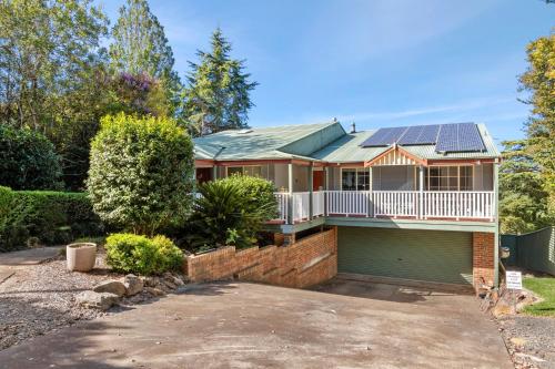 a house with solar panels on the roof at Bells Rest with a veiw in Kurrajong