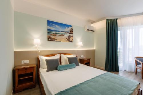 Postel nebo postele na pokoji v ubytování Hotel Amiral
