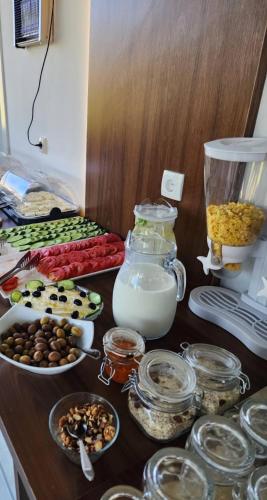 a counter with many different types of food on it at Sunrise Apart-Hotel in Ulcinj