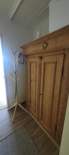 a room with a wooden cabinet in a room at Maria Altreichenau in Neureichenau