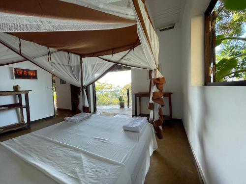 a bedroom with two beds in a room at Makako Lodge in Ampangorinana
