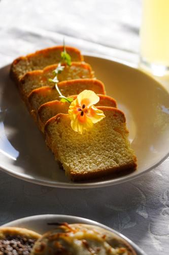 a plate with a piece of bread with a flower on it at Le Cedrus Hotel in Al Arz