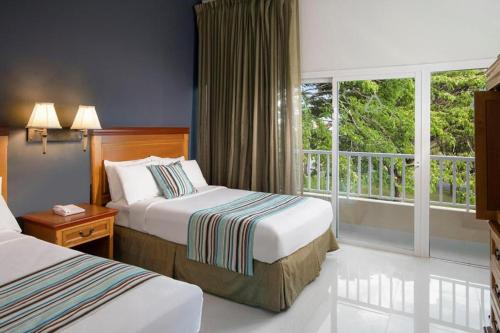 Postel nebo postele na pokoji v ubytování Hodelpa Garden Suites - All Inclusive