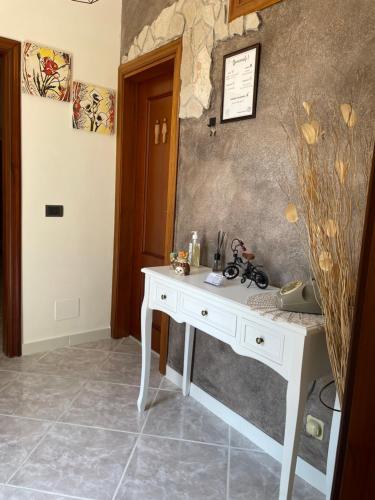 a white desk in a room with a wall at La casa dei nonni in San Salvo