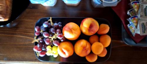 a bowl of fruit on top of a table at Kastania Gi in Palaios Panteleimon