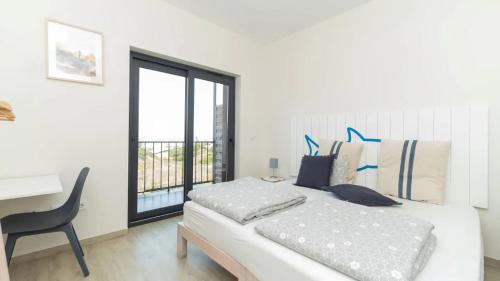 Ένα ή περισσότερα κρεβάτια σε δωμάτιο στο WOT Ericeira Surf Hostel