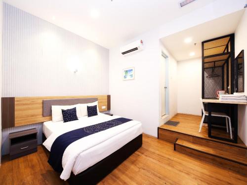 Postel nebo postele na pokoji v ubytování Agape Hotel Selayang