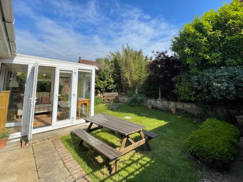 a picnic table in the backyard of a house at Bilbo's Cottage, Sheringham in Sheringham