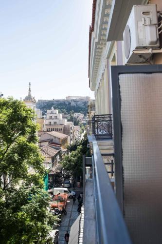 a view of a city street from a balcony at Tempi Hotel in Athens