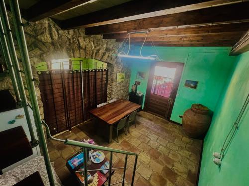 an overhead view of a room with a table and green walls at Marnabianca Apartment in Realmonte