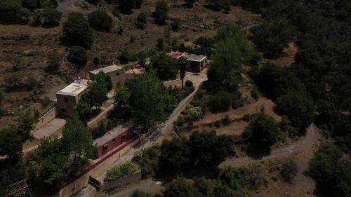 an aerial view of a house with a train station at Akros Oreon Houses in Káto Sími