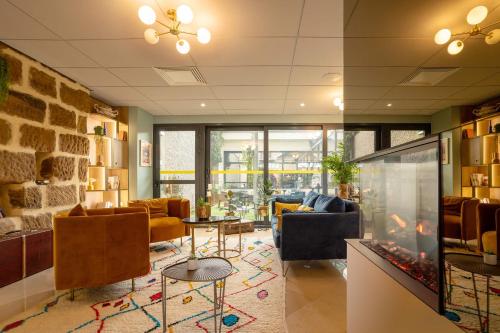 Zona de estar de Best Western Hotel Le Quercy