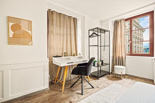 a white bathroom with a sink and a desk at A&Y LakeHouse Golden Swan in Luzern