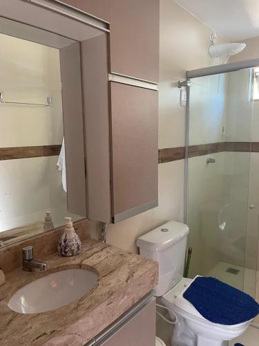 a bathroom with a sink and a toilet and a shower at Sonhos da Serra - apartamento 201 - A in Bananeiras