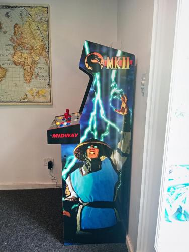 a halloween display for a room with a movie on it at Woy Woy Staycation - Heated Pool & Hot Tub & BBQ & Pizza Oven & Arcade Game & Pool Table in Woy Woy