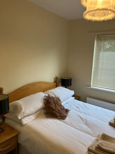 Letto o letti in una camera di Whitethorn Cottage, Palmfield