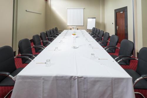a long table in a conference room with chairs at Best Western Sheffield City Hotel in Sheffield