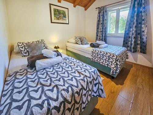 Katil atau katil-katil dalam bilik di Holiday Home Dubrove by Interhome