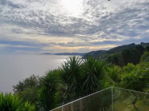 a view of a body of water with trees at PIPER ETXEA Relax, mar y monte! in Mutriku