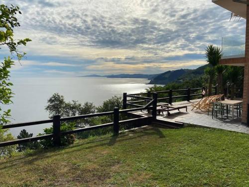 a house with a view of a body of water at PIPER ETXEA Relax, mar y monte! in Mutriku